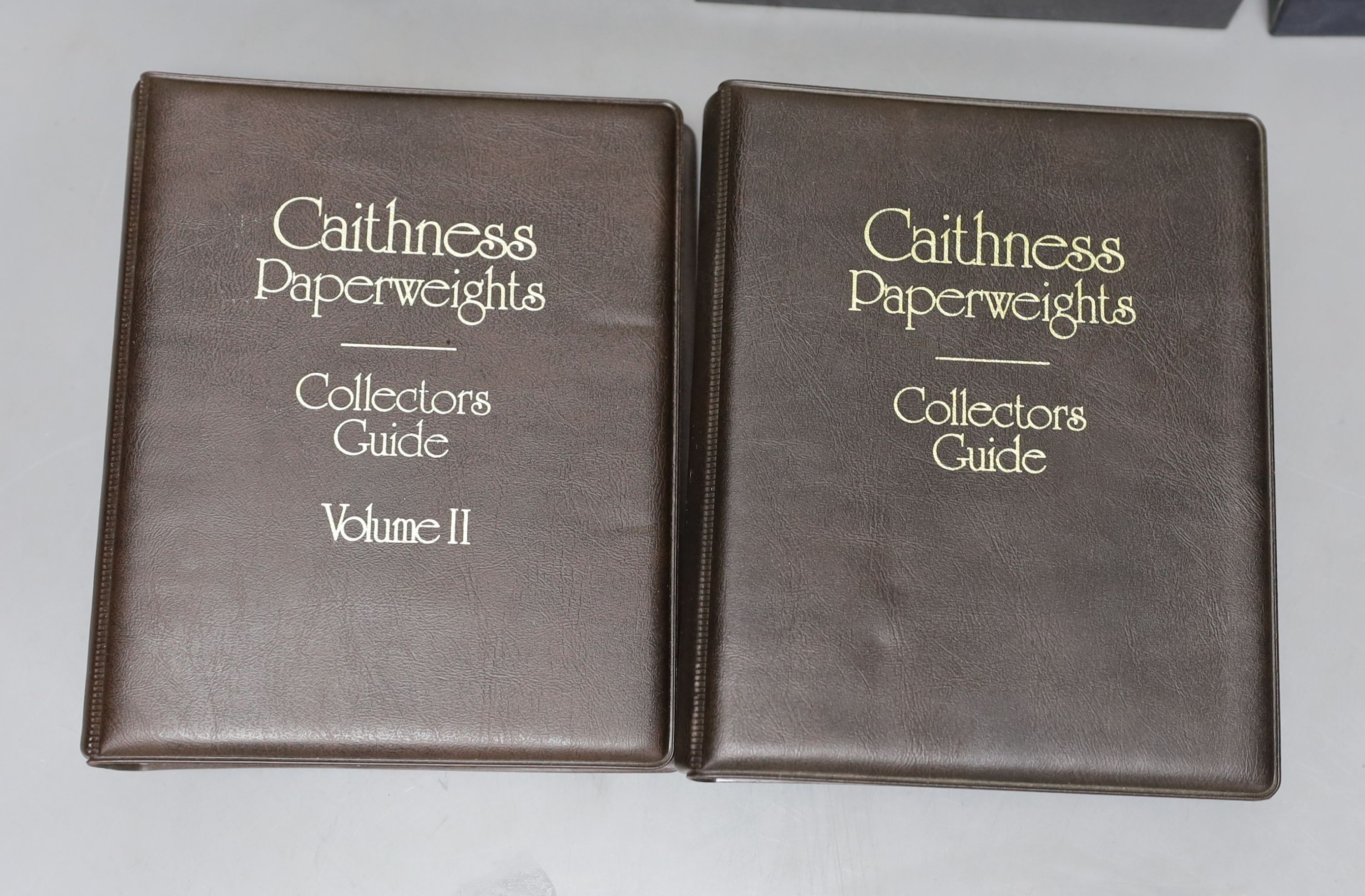 Four cased Caithness glass paperweights